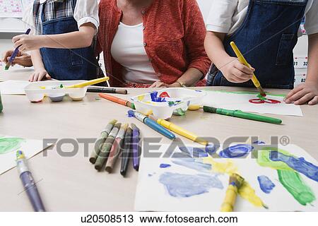 Teacher Watching Students Paint View Large Photo Image Stock Image - Teacher Watching Students Paint. Fotosearch