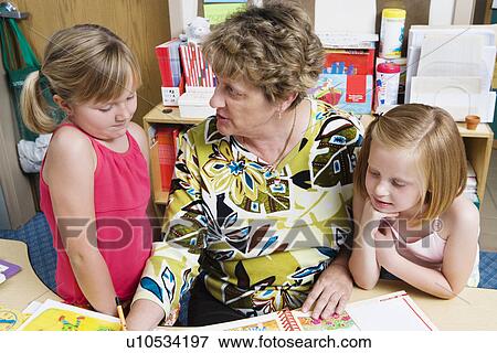 Stock Photo - Teacher with Elementary Students. Fotosearch