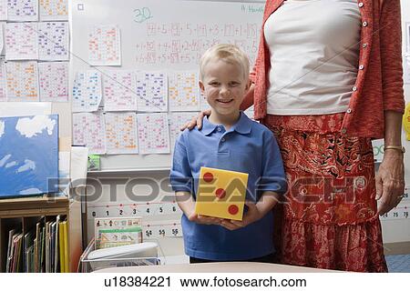 Teacher with Little Boy Holding Large Die View Large Photo Image Stock Image - Teacher with Little Boy Holding Large Die. Fotosearch