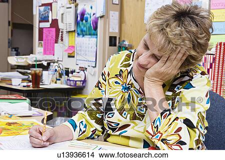 Picture - Teacher Working at Desk. Fotosearch