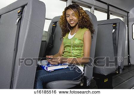 Teenage Girl Listening to MP3 Player on Bus View Large Photo Image Stock Photograph - Teenage Girl Listening to MP3 Player on Bus. Fotosearch