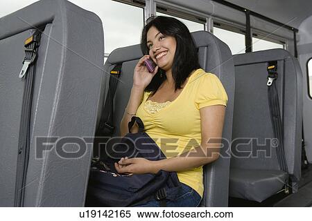 Teenage Girl Using Cell Phone on Bus View Large Photo Image Stock Photography - Teenage Girl Using Cell Phone on Bus. Fotosearch