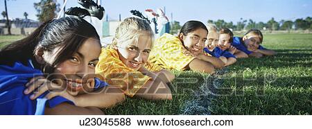 Teenage girls (13-16) lying in row on soccer field View Large Photo Image Stock Photo - Teenage girls (13-16) lying in row on soccer field. Fotosearch