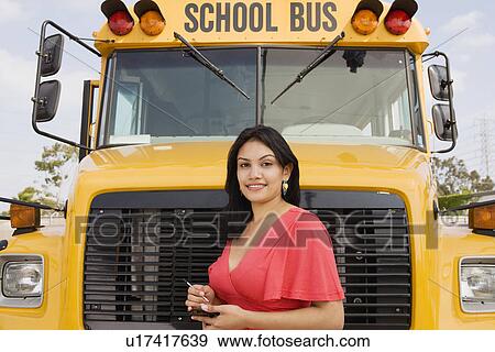 Stock Photo - Teenager Girl by School Bus. Fotosearch