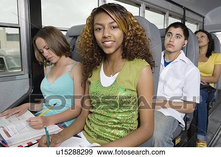 Teenagers Doing Homework While Riding School Bus View Large Photo Image Stock Photo - Teenagers Doing Homework While Riding School Bus. Fotosearch