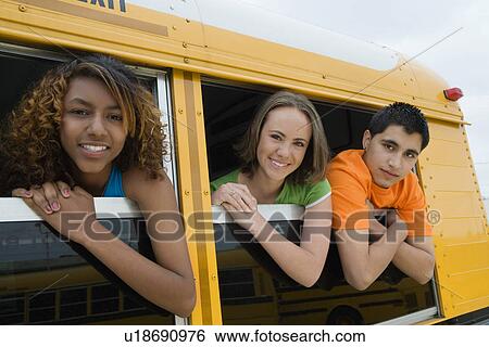 Stock Photograph - Teenagers on School Bus. Fotosearch