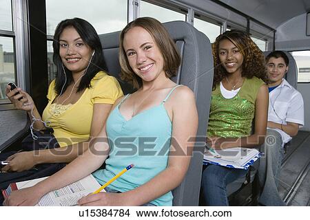 Picture - Teenagers Riding School Bus. Fotosearch