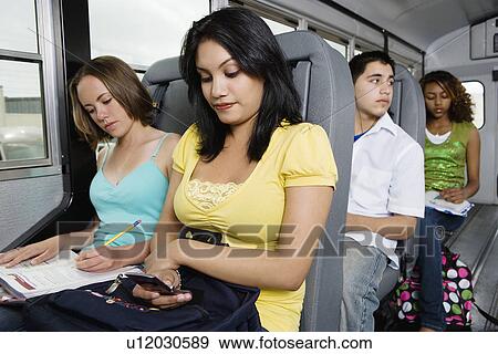 Teenagers Riding School Bus View Large Photo Image Stock Photo - Teenagers Riding School Bus. Fotosearch
