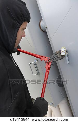 Thief cutting lock View Large Photo Image Picture - Thief cutting lock. Fotosearch