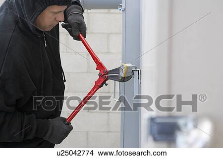 Thief cutting lock View Large Photo Image Picture - Thief cutting lock. Fotosearch