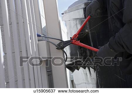 Thief cutting lock View Large Photo Image Stock Photo - Thief cutting lock. Fotosearch