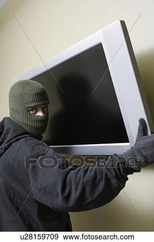 Stock Photo - Thief stealing flat screen television. Fotosearch