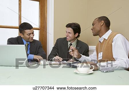 Three business men talking View Large Photo Image Picture - Three business men talking. Fotosearch