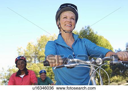 Three seniors riding bicycles View Large Photo Image Stock Photograph - Three seniors riding bicycles. Fotosearch