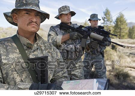Stock Photo - Three soldiers during training. Fotosearch