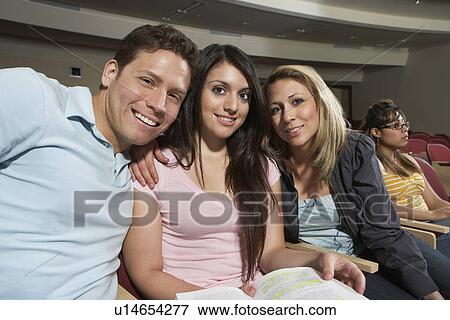 Three students smiling in class, portrait View Large Photo Image Stock Photo - Three students smiling in class, portrait. Fotosearch