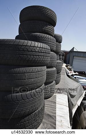 Stock Image - Tires in Junkyard. Fotosearch