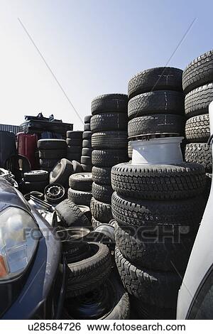 Stock Photograph - Tires in junkyard. Fotosearch