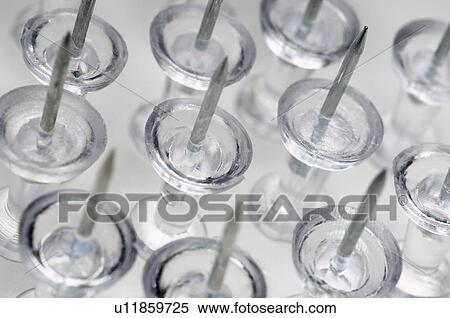 Transparent thumbtacks, close-up View Large Photo Image Stock Photography - Transparent thumbtacks, close-up. Fotosearch
