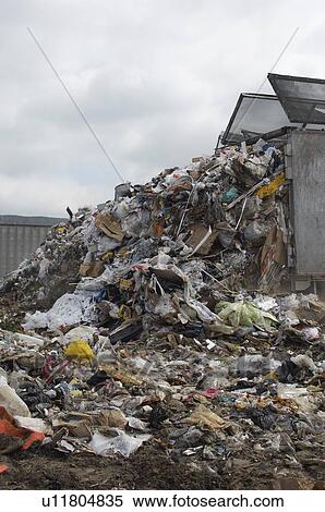 Truck dumping waste at landfill site View Large Photo Image Stock Photography - Truck dumping waste at landfill site. Fotosearch