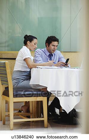 Two business colleagues in office meeting View Large Photo Image Stock Image - Two business colleagues in office meeting. Fotosearch