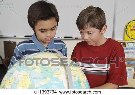 Picture - Two friends in classroom. Fotosearch