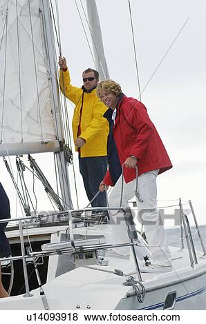 Stock Photo - Two men on yacht. Fotosearch
