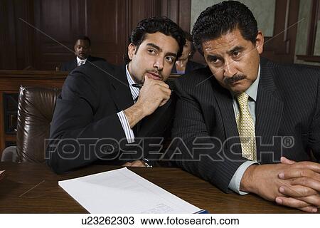 Two men sitting in court View Large Photo Image Stock Image - Two men sitting in court. Fotosearch
