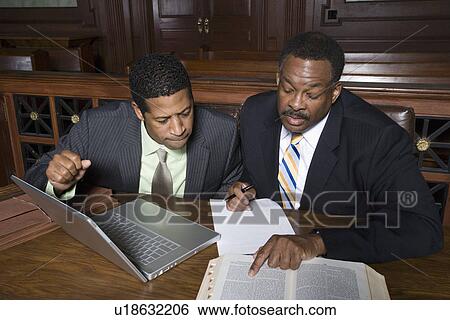 Two men working in court View Large Photo Image Stock Photograph - Two men working in court. Fotosearch