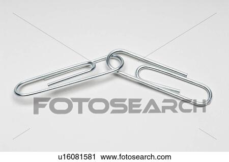 Stock Image - Two silver paper clips on white background. Fotosearch