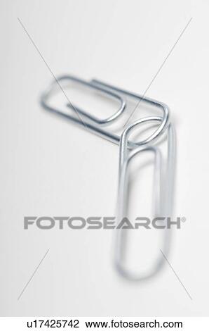 Stock Image - Two silver paper clips on white background. Fotosearch