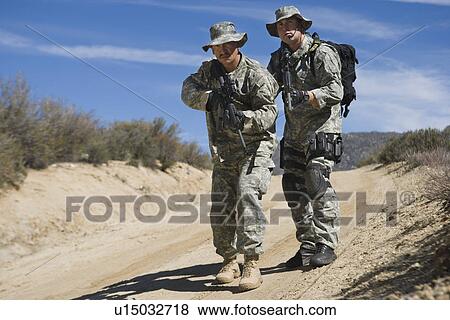 Two soldiers during training View Large Photo Image Stock Photo - Two soldiers during training. Fotosearch