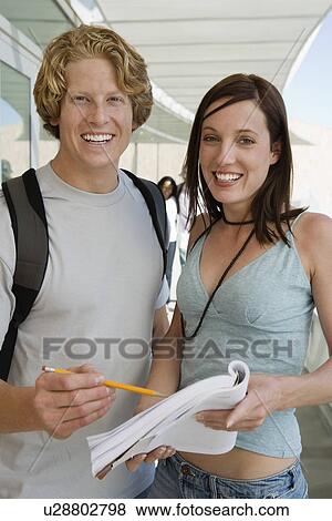 Two students smiling in school, portrait View Large Photo Image Stock Photo - Two students smiling in school, portrait. Fotosearch