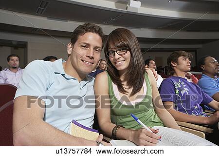 Two students working in class, portrait View Large Photo Image Picture - Two students working in class, portrait. Fotosearch