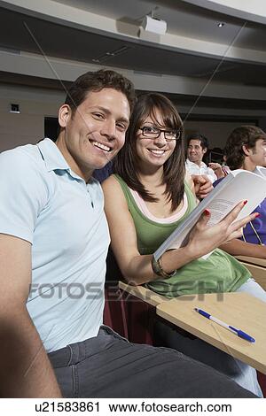 Two students working in class, portrait View Large Photo Image Stock Image - Two students working in class, portrait. Fotosearch