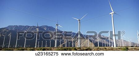 Valley of wind turbines in desert View Large Photo Image Stock Photography - Valley of wind turbines in desert. Fotosearch