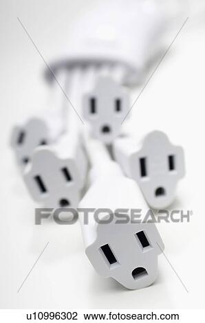 Stock Image - White power extension cords, close-up. Fotosearch