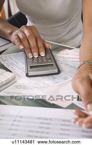 Woman Calculating Bills View Large Photo Image Stock Image - Woman Calculating Bills. Fotosearch