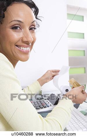 Woman Calculating Finances View Large Photo Image Stock Photo - Woman Calculating Finances. Fotosearch