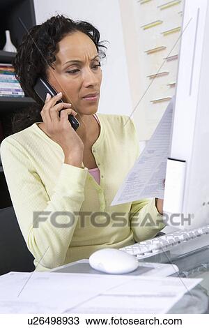 Stock Image - Woman Dealing with a Bill. Fotosearch