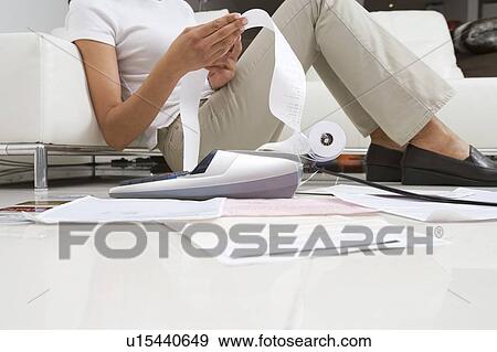 Stock Photo - Woman Doing Finances. Fotosearch