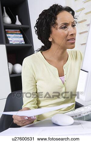 Stock Image - Woman Doing Personal Finances. Fotosearch