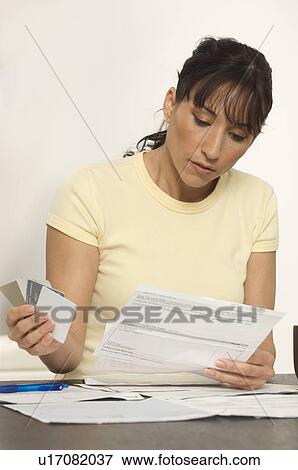 Woman Figuring out Bills View Large Photo Image Stock Photo - Woman Figuring out Bills. Fotosearch