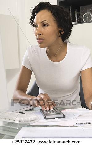 Woman Figuring out Personal Finances View Large Photo Image Stock Image - Woman Figuring out Personal Finances. Fotosearch