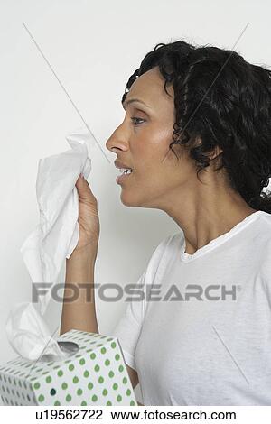 Woman holding box of tissues, studio shot View Large Photo Image Stock Image - Woman holding box of tissues, studio shot. Fotosearch