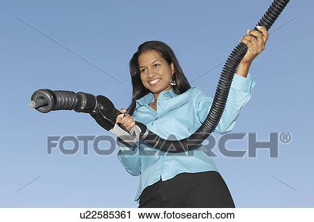 Woman holding fuel pump View Large Photo Image Stock Image - Woman holding fuel pump. Fotosearch