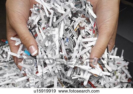 Woman holding heap of shredded paper, close-up of hands View Large Photo Image Stock Photo - Woman holding heap of shredded paper, close-up of hands. Fotosearch