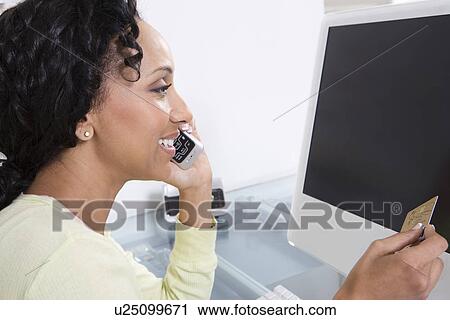 Woman Making an Online Transaction View Large Photo Image Stock Image - Woman Making an Online Transaction. Fotosearch