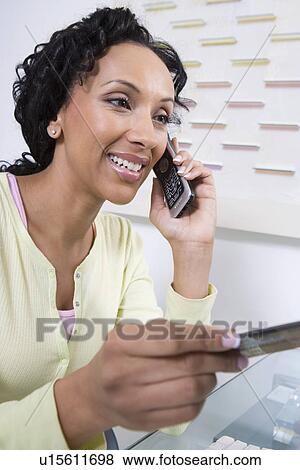 Woman Making an Online Transaction View Large Photo Image Stock Photo - Woman Making an Online Transaction. Fotosearch