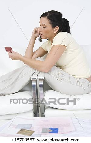 Stock Photo - Woman Placing Order on Cell Phone. Fotosearch